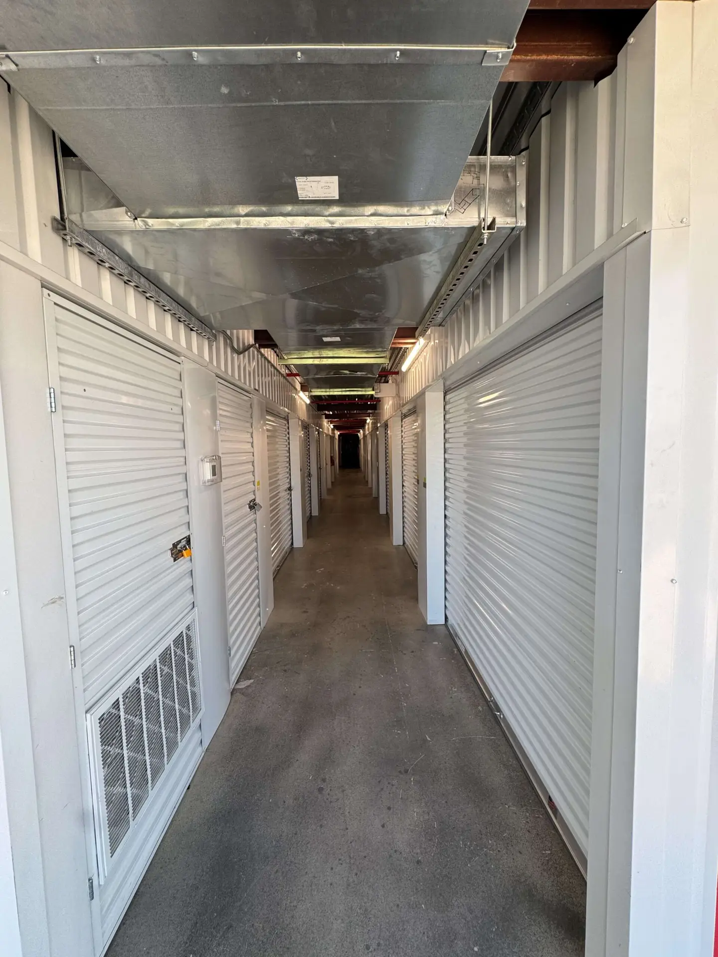Climate-controlled storage unit doors in a row at Tower Oaks