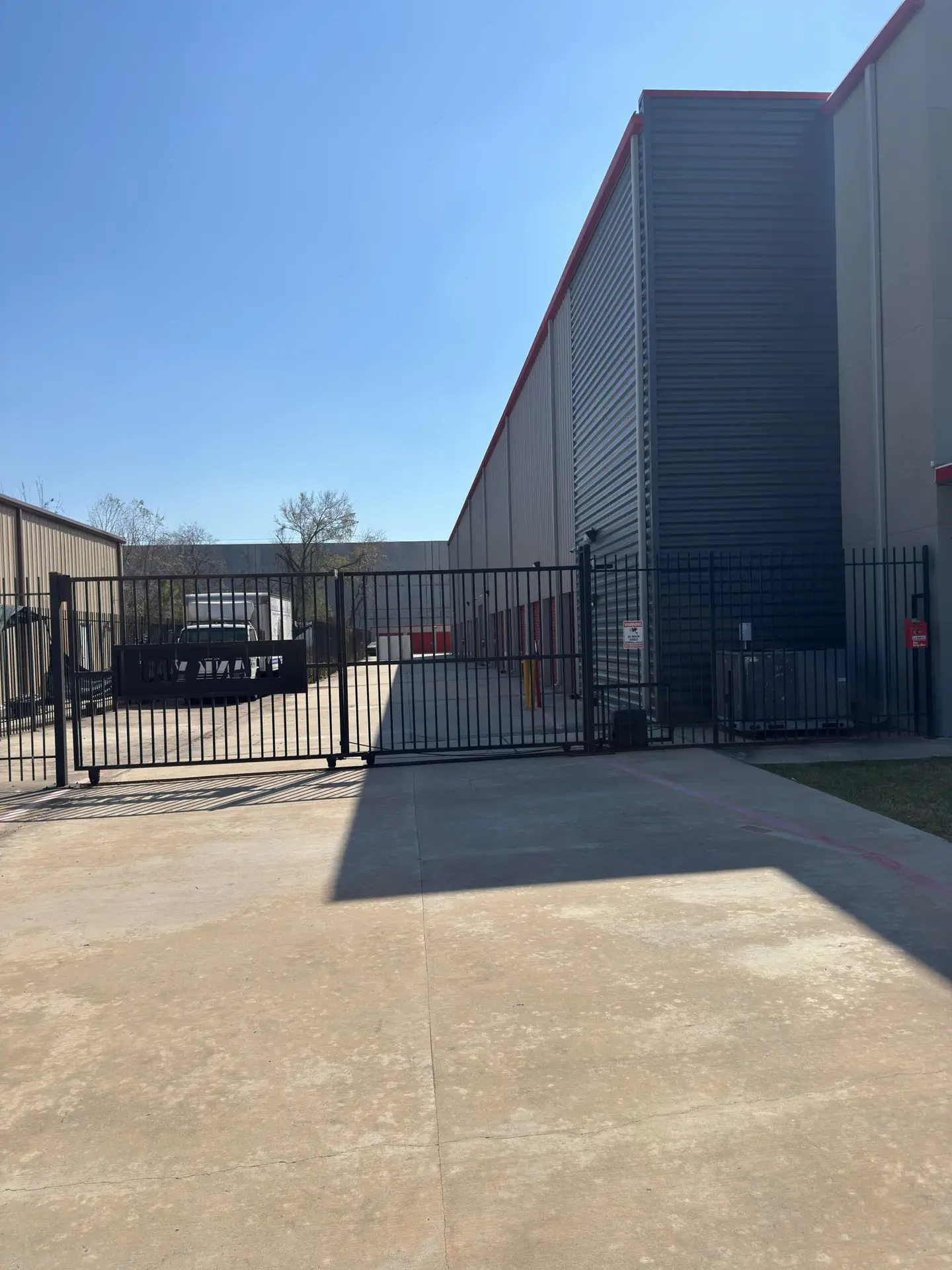Hallway view of interior storage units with roll-up doors