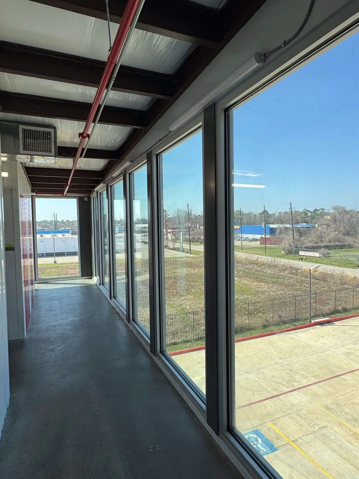 Row of secure metal roll-up doors at Tower Oaks storage facility