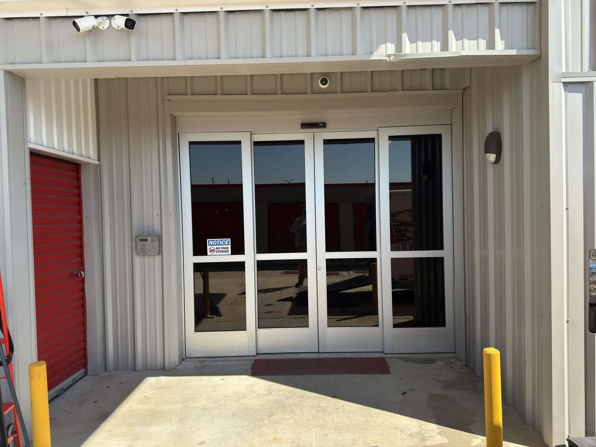 Well-lit corridor between climate-controlled storage units at Tower Oaks
