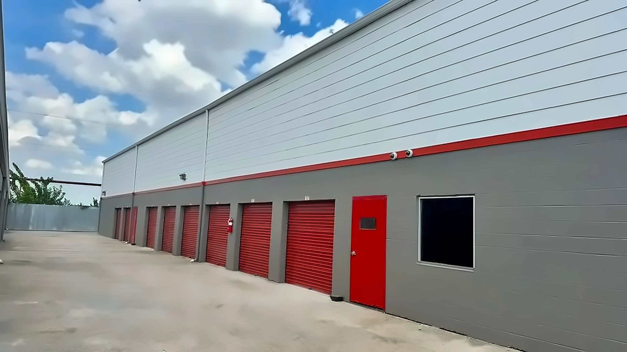Row of outdoor storage units with metal doors